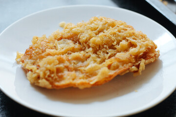 Pisang goreng or fried banana. Popular street food in Southeast Asia, especially in Indonesia, Malaysia, and Singapore. Selective focus.