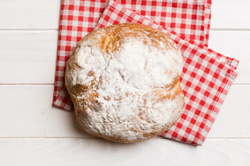 Fresh homemade crisp round bread on napkin, top view. Healthy unleavened bread. French bread. Top...