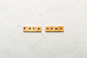 fake news word written on wood block. fake news text on table, concept