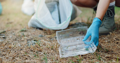 Person, hands and plastic with bag for recycling, climate change or global warming in nature. Closeup, volunteer or community service with dirt, garbage or container for cleaning litter or earth day