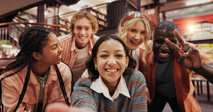 College library, friends and selfie of students with peace sign, picture or POV of people together. Portrait, happy group and photography at university for study break, education or social media post
