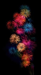 A vibrant display of fireworks lights up the night sky, bursting in a kaleidoscope of colors&mdash;reds, blues, and golds&mdash;creating a dazzling spectacle that captivates onlookers below.