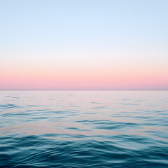 Obraz premium Seascape Sunset: A tranquil sea under a pastel sky, the horizon dividing the soft gradients of the dusk sky and reflecting on the water, evokes serenity and peace.