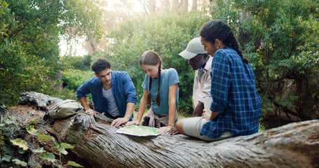 Hiking, map and friends in nature with paper for navigation, direction and location for trekking. Fitness, group and people in conversation with guide on adventure, journey and travel outdoors