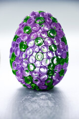 Decorative Easter Craft. Close-up of a handmade Easter egg adorned with rolled paper designs.