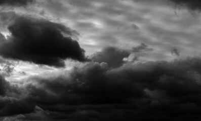 Obraz premium dark dramatic sky with black stormy clouds before rain as abstract background, extreme weather