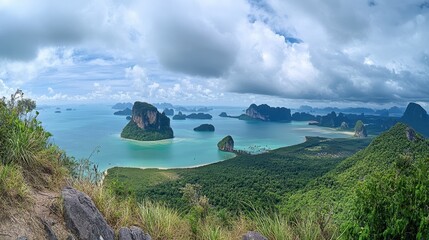 Panoramic view of towering limestone cliffs and emerald waters in Ao Phang Nga National Park.