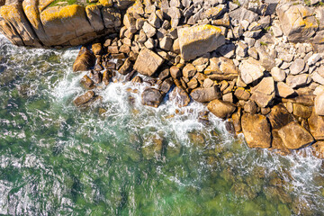 rocky coast as a background. Beautiful natural background at the summer. Aerial drone top view
