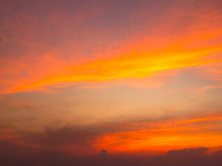 Fototapeta premium Sky sunset evening sunrise cloud weather dramatic landscape goldent and indigo color gradient pastel horizon, twilight yellow golden reflection morning nature environment energy ecosystem change.