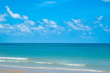 Nature of the beach and sea Summer with sunshine, sandy beaches, clear blue waters sparkling against the blue sky. On an island with good ecology and environment Background for summer vacation