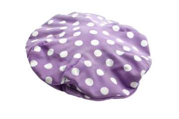 A whimsical purple hat adorned with white polka dots resting gently on a clean, bright surface inviting playful imagination isolated on transparent background