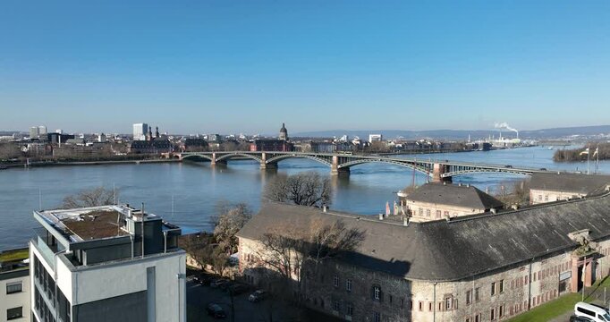 Drone ascending on Museum Castellum to reveal Theodor Heuss Bridge over the Rhine River in Wiesbaden