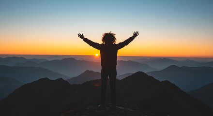 Fototapeta premium Silhouette of Person with Arms Raised Watching Sunrise Over Layered Mountains