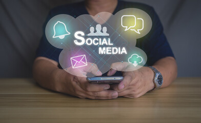 Man using smartphone with social media icons. Concept of digital marketing, online communication, mobile app, and internet connection in modern lifestyle.