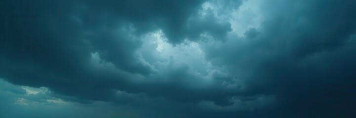Obraz premium Dense, grey storm clouds gather ominously overhead , weather, scenic