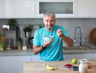 kitchen food man healthy morning mature breakfast active fitness diet home healthy senior adult ...