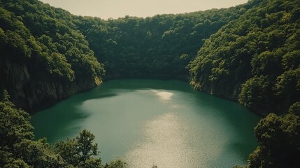 Obraz premium Serene Crater Lake nestled within lush forest