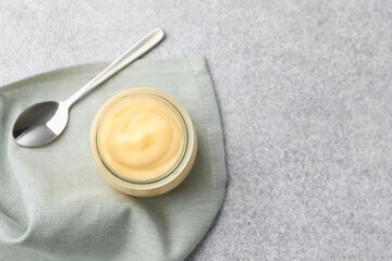 Tasty vanilla pudding served on grey table, top view. Space for text