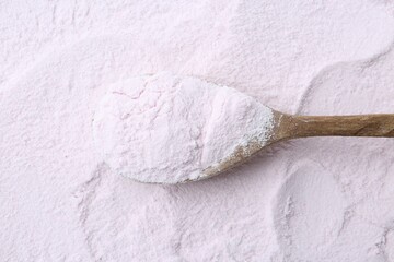 Superfood. Acerola powder and spoon, top view