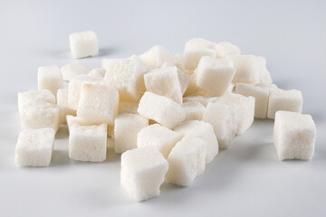 Lump sugar on a white background.