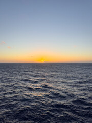 Sunset on the horizon at sea in the Caribbean