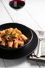 Mezze maniche con ragù alla bolognese, pasta italiana 