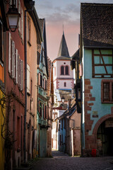 Medieval street and tower in Riquewihr in Alsace, France
