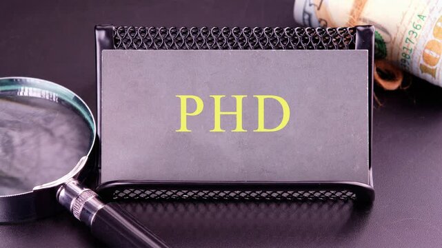 Close-up animation of the PHD text, accompanied by a magnifying glass and cash symbolizing dedication. Business concep