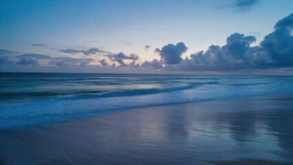 Calm waters at sunset with clouds and horizon reflections