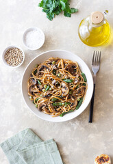 Udon noodles in teriyaki sauce with mushrooms, beans and peas. Asian cuisine. Vegetarian food.
