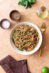 Udon noodles in teriyaki sauce with mushrooms, beans and peas. Asian cuisine. Vegetarian food.