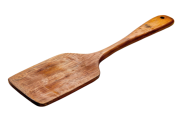 A vintage wooden spatula resting on a bright background ready for culinary adventures at home isolated on transparent background