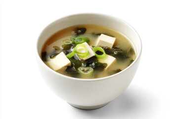 Traditional Japanese miso soup with tofu, seaweed, and green onion in white bowl, isolated on white background