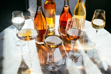 Different types of wine in glasses - red, white, rose and amber. Wine tasting in a bar or restaurant.