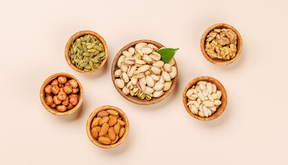 A vibrant assortment of various nuts, including almonds, walnuts, hazelnuts, cashews, and pistachios
