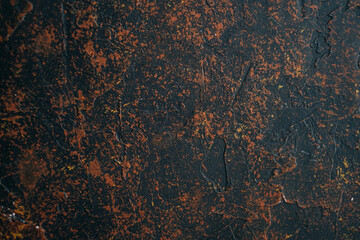 Black and brown textured background photo with ocher spots