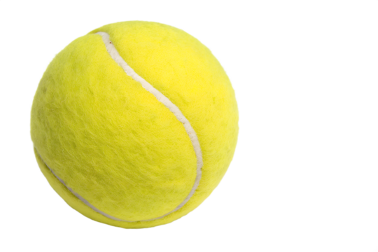 Close Up Of A Bright Yellow Tennis Ball Against Black Background