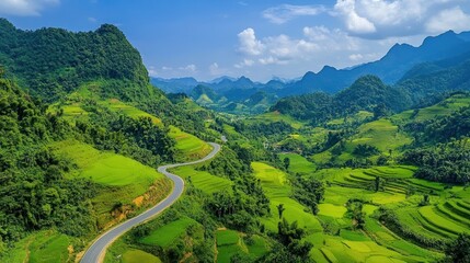 Fototapeta premium Winding road through lush valleys