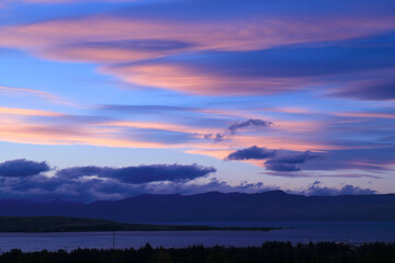 Naklejka premium Gorgeous Evening Sky with Pink Afterglow over the Lake Argentino View from the Town of El Calafate, Patagonia, Argentina, South America