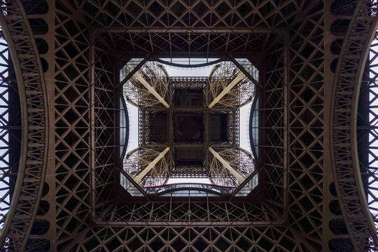 Underneath the Eiffel Tower in Paris, France - Powered by Adobe