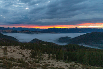 orange sky before dawn in the mountains
