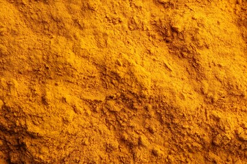 Aromatic turmeric powder as background, top view
