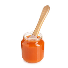 Baby food. Tasty puree in glass jar and spoon isolated on white