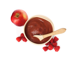 Baby food. Tasty puree in bowl, spoon, apple and raspberries isolated on white, top view