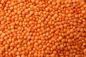 Raw red lentils as background, closeup view