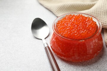 Delicious red caviar on light table, closeup