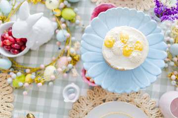Easter table setting with blue platter and cake