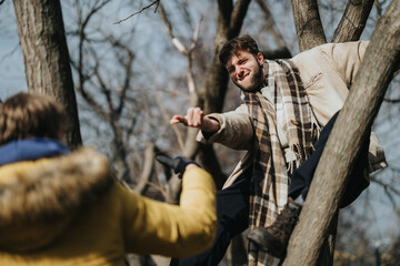 Two friends bonding in a wintry forest as one assists the other while climbing a tree, showcasing...