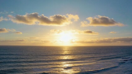 Fototapeta premium Serene sunset over a calm ocean