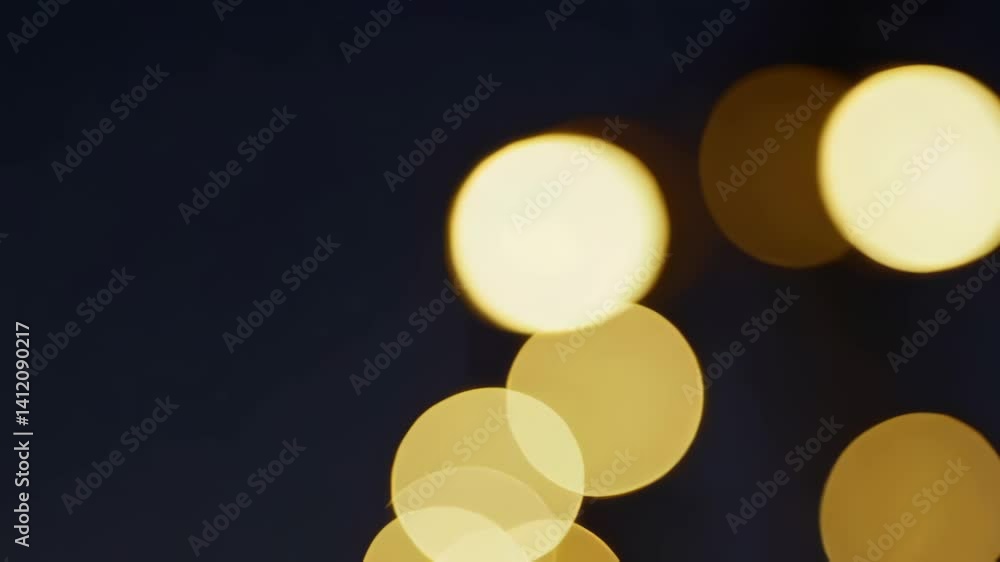 Poster golden bokeh lights transitioning against a dark backdrop